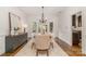 Elegant dining room with chandelier, hardwood floors and ample natural light at 2600 Oakmeade Dr, Charlotte, NC 28270