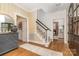 Inviting foyer with hardwood floors, staircase, and elegant decor at 2600 Oakmeade Dr, Charlotte, NC 28270