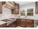 Modern kitchen with stainless steel appliances and dark wood cabinets at 2600 Oakmeade Dr, Charlotte, NC 28270