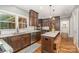Spacious kitchen with dark wood cabinets, stainless steel appliances, and granite countertops at 2600 Oakmeade Dr, Charlotte, NC 28270