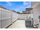 Private backyard with a white fence, patio, and space for outdoor activities and relaxation at 3127 Ocalle Ln, Indian Land, SC 29707