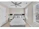 Neutral bedroom featuring a ceiling fan, window, and comfortable bed with side tables at 3127 Ocalle Ln, Indian Land, SC 29707