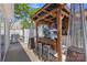 Cozy outdoor bar with a wooden pergola, string lights, seating, and barbecue grill at 3127 Ocalle Ln, Indian Land, SC 29707