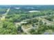 Overhead view of a residence nestled in a lush, green neighborhood with mature trees offering privacy and shade at 3219 Spring Valley Dr, Gastonia, NC 28052