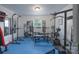 Fully-equipped home gym with weights, machines, and mirrors for a complete workout experience at 3219 Spring Valley Dr, Gastonia, NC 28052
