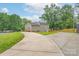 A charming home with a large driveway and ample backyard space, perfect for outdoor activities and entertaining at 3219 Spring Valley Dr, Gastonia, NC 28052
