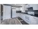 The kitchen features white appliances, ample counter space, and stylish flooring at 3219 Spring Valley Dr, Gastonia, NC 28052