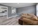 Cozy living room with gray walls, modern floors, and comfortable couches at 3219 Spring Valley Dr, Gastonia, NC 28052