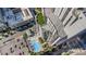 Bird's-eye view of the building with a sparkling pool, outdoor lounge, and manicured landscaping, an urban oasis at 333 W Trade St # 805, Charlotte, NC 28202