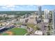 Aerial view of the building offering views of uptown Charlotte, baseball park and mature trees at 333 W Trade St # 805, Charlotte, NC 28202