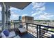 Balcony with comfortable seating area and a beautiful city view at 333 W Trade St # 805, Charlotte, NC 28202