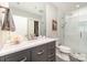 Modern bathroom featuring a walk-in shower and vanity with marble countertop at 333 W Trade St # 805, Charlotte, NC 28202