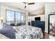 Bedroom featuring a large sliding glass door with a beautiful city view and an ensuite at 333 W Trade St # 805, Charlotte, NC 28202
