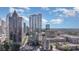 Exterior of a modern high-rise condo building featuring floor-to-ceiling windows and sleek architectural design at 333 W Trade St # 805, Charlotte, NC 28202