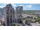 A modern high-rise condo building offering panoramic views of the surrounding cityscape and lush greenery at 333 W Trade St # 805, Charlotte, NC 28202