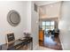 Hallway with tile entry leading to hardwood flooring and bright living space at 333 W Trade St # 805, Charlotte, NC 28202