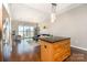 Open concept kitchen and living room with hardwood floors and natural light at 333 W Trade St # 805, Charlotte, NC 28202