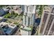 High-rise featuring a rooftop pool, lounging area and mature trees for shade and privacy at 333 W Trade St # 805, Charlotte, NC 28202