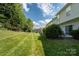 Expansive backyard with lush lawn and mature trees at 3412 Summerfield Ridge Ln, Matthews, NC 28105
