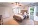 Cozy bedroom with neutral color palette and ceiling fan at 3412 Summerfield Ridge Ln, Matthews, NC 28105