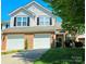 Charming two-story home with a two-car garage, brick accents, and well-manicured lawn at 3412 Summerfield Ridge Ln, Matthews, NC 28105