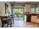 Bright eat-in kitchen with a sliding glass door leading to the backyard patio at 3412 Summerfield Ridge Ln, Matthews, NC 28105