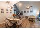 Open-concept living area with dining space, vaulted ceilings, and modern decor at 3412 Summerfield Ridge Ln, Matthews, NC 28105