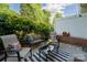 Charming outdoor patio with seating area and lush greenery at 3412 Summerfield Ridge Ln, Matthews, NC 28105