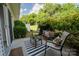 Charming outdoor patio with seating area and lush greenery at 3412 Summerfield Ridge Ln, Matthews, NC 28105