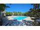 Community swimming pool with lounge chairs, providing a perfect spot for relaxation and recreation at 3412 Summerfield Ridge Ln, Matthews, NC 28105