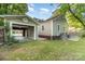 A home with a detached garage that has an open entrance and a well-manicured lawn at 3612 The Plz, Charlotte, NC 28205
