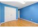 Bedroom features bamboo flooring, blue painted walls and bright white trim at 3744 Leela Palace Way, Fort Mill, SC 29708