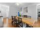 Dining room with hardwood floors, fireplace, and plenty of natural light at 3744 Leela Palace Way, Fort Mill, SC 29708