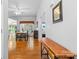 Bright dining room features hardwood floors, natural light, and an elegant ceiling fan at 3744 Leela Palace Way, Fort Mill, SC 29708