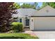 Lovely home with an inviting front door, well-kept lawn, mature tree and a two-car garage at 3744 Leela Palace Way, Fort Mill, SC 29708