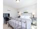 Bedroom with neutral walls and featuring a metal bed frame and dresser with lamps at 4012 Martele Dr, Mint Hill, NC 28227