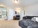 Bright upstairs bonus room features a lounge area, neutral carpet, and ample seating, perfect for relaxing at 4012 Martele Dr, Mint Hill, NC 28227