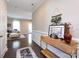 Inviting entryway featuring dark hardwood floors, a stylish console table, and an open view into the living area at 4012 Martele Dr, Mint Hill, NC 28227