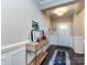 Elegant entryway featuring hardwood floors, wainscoting, stylish console table, and ample natural light at 4012 Martele Dr, Mint Hill, NC 28227