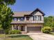 Charming two-story home featuring a brick and siding exterior, attached garage, and well-manicured lawn at 4012 Martele Dr, Mint Hill, NC 28227