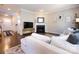Cozy living room featuring a fireplace, dark hardwood floors, and a comfortable white sofa at 4012 Martele Dr, Mint Hill, NC 28227