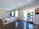 Bright living room with hardwood floors, a sectional sofa, and access to the outdoors at 4012 Martele Dr, Mint Hill, NC 28227
