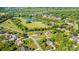 Expansive aerial view showcasing the community's pond, lush greenery, and single Gathering homes at 4047 Rainbow Hills Dr, Hickory, NC 28602