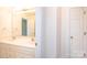 Bathroom with double vanity, granite counters, and a framed mirror at 4047 Rainbow Hills Dr, Hickory, NC 28602