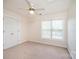 Neutral bedroom featuring carpet, a ceiling fan and a window allowing natural light at 4047 Rainbow Hills Dr, Hickory, NC 28602