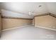 Spacious bonus room with neutral carpet, sloped ceilings, and colorful trim at 4047 Rainbow Hills Dr, Hickory, NC 28602