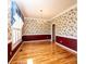 Formal dining room with hardwood floors, wainscoting, and decorative wallpaper at 4047 Rainbow Hills Dr, Hickory, NC 28602