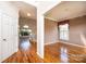 Bright foyer with hardwood flooring and staircase leading to the second floor and an adjacent sitting room at 4047 Rainbow Hills Dr, Hickory, NC 28602
