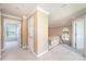 Upstairs hallway with neutral carpet, trim and doors leading to multiple rooms at 4047 Rainbow Hills Dr, Hickory, NC 28602