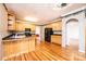 Eat-in kitchen with hardwood floors, wooden cabinets, and black appliances at 4047 Rainbow Hills Dr, Hickory, NC 28602